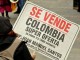 Cartel de protesta contra implantación del TLC - Foto: Agencia Prensa Rural